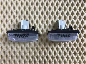 Фонарь подсветки номера Nissan Tiida (C11) 2007-2014 — фото 2