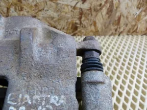 Суппорт тормозной передний левый Hyundai Elantra 2006-2011 (581802HA00) — фото 7