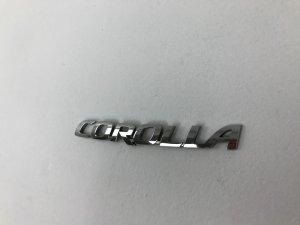 Эмблема Toyota Corolla Axio (2012-2015) — фото 1